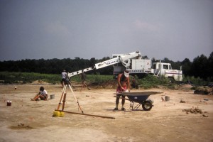 Gradall stripping topsoil and plowzone.