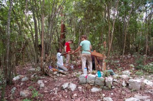 Students working at Unit 2. Note the cut limestone foundation in the foreground.