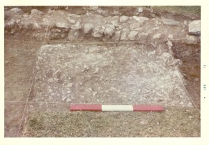 Packed marl floor and west foundation wall of House 14. Photograph taken January 1976.