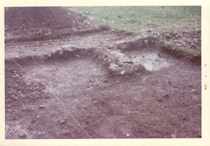 View of House 26 north foundation wall and partition, from south. Photograph taken August 1975.