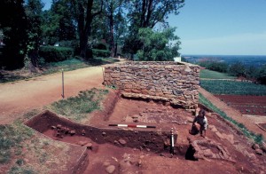 View of Smokehouse-Dairy excavations (facing east). Note the brick box in the foreground and the brick paving and 1809 Stone House in the background. Jefferson family vegetable garden is to the right down slope.