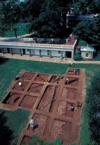 Excavation Overview. Caption: Overview of East Kitchen Yard excavations, c.1985, with Monticello Mansion in the background.