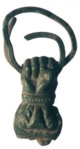 Brass hand charm excavated in plowzone/destruction layer outside Cabin 3.