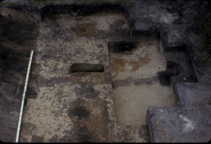 View of Main Block Excavation showing Features 2, and postholes 67.1, 67.2 and 67.3, facing grid west. Photograph taken in 1988.