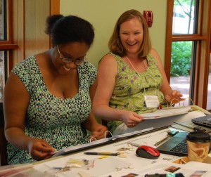 Camille Chambers (William and Mary) and Sarah Stroud Clarke (Drayton Hall) catalog artifacts during DAACS Research Consortium Training.
